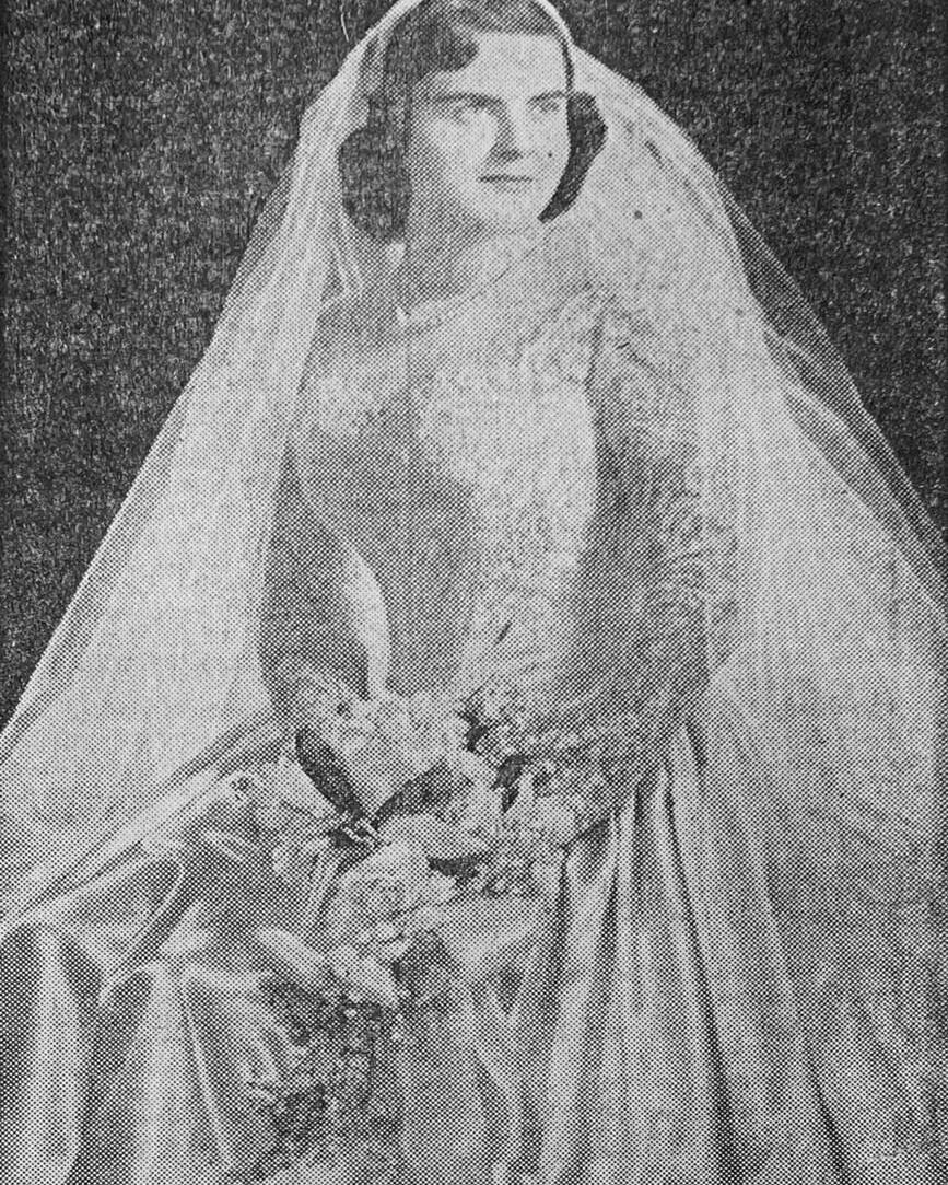 old newspaper clipping image of bride in bridal gown with veil and bouquet