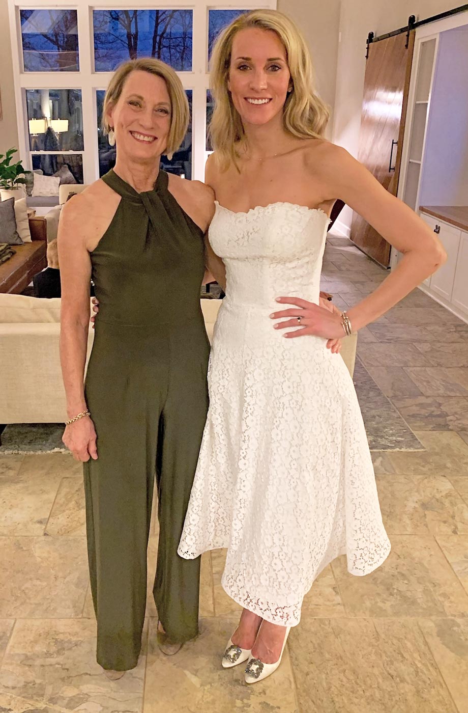 photo of bride and mother at rehearsal dinner in reimagined gown